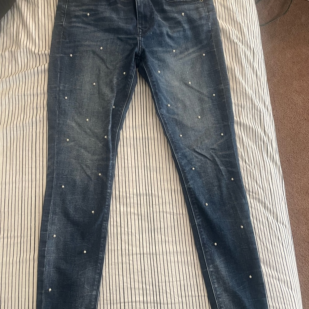 Denim jeans with pearls on front. Excellent condition.